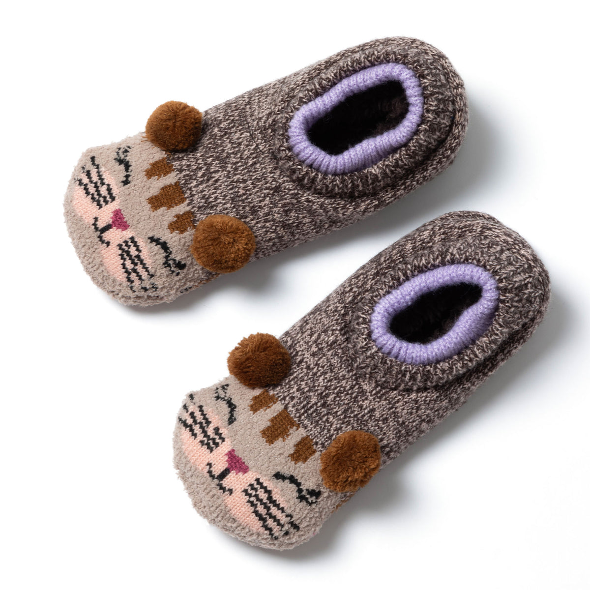 Knitted slipper socks with cat faces on top with pom pom ears, on a flat white surface. Pom Pom Cat with a plush interior