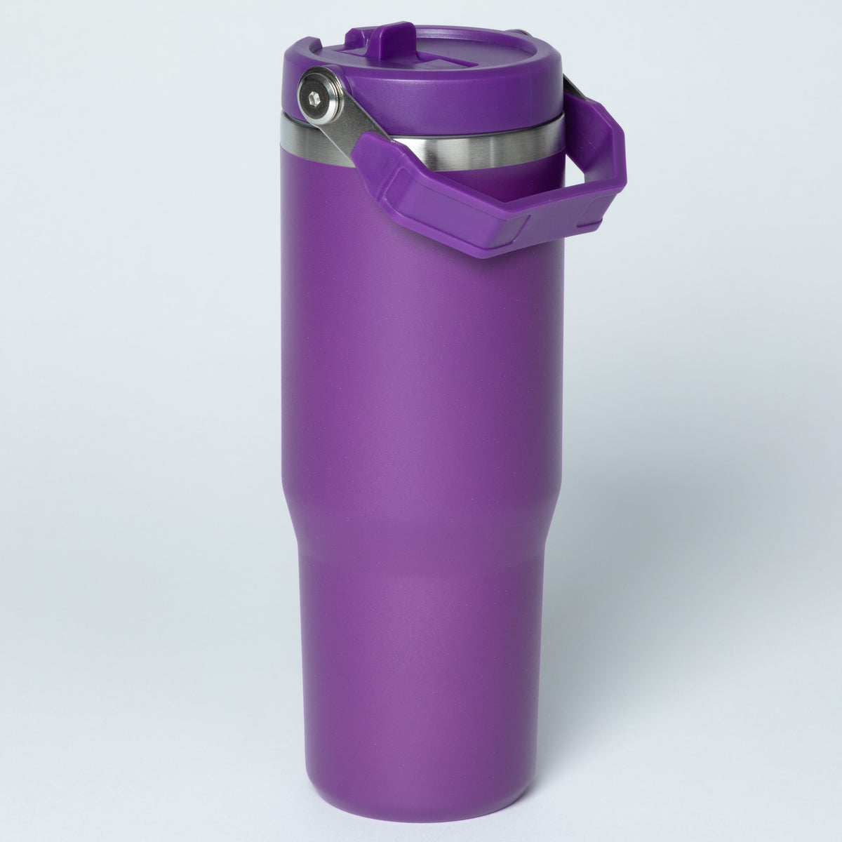Purple insulated travel mug with a handle and secure lid. Ideal for drinks on the go.