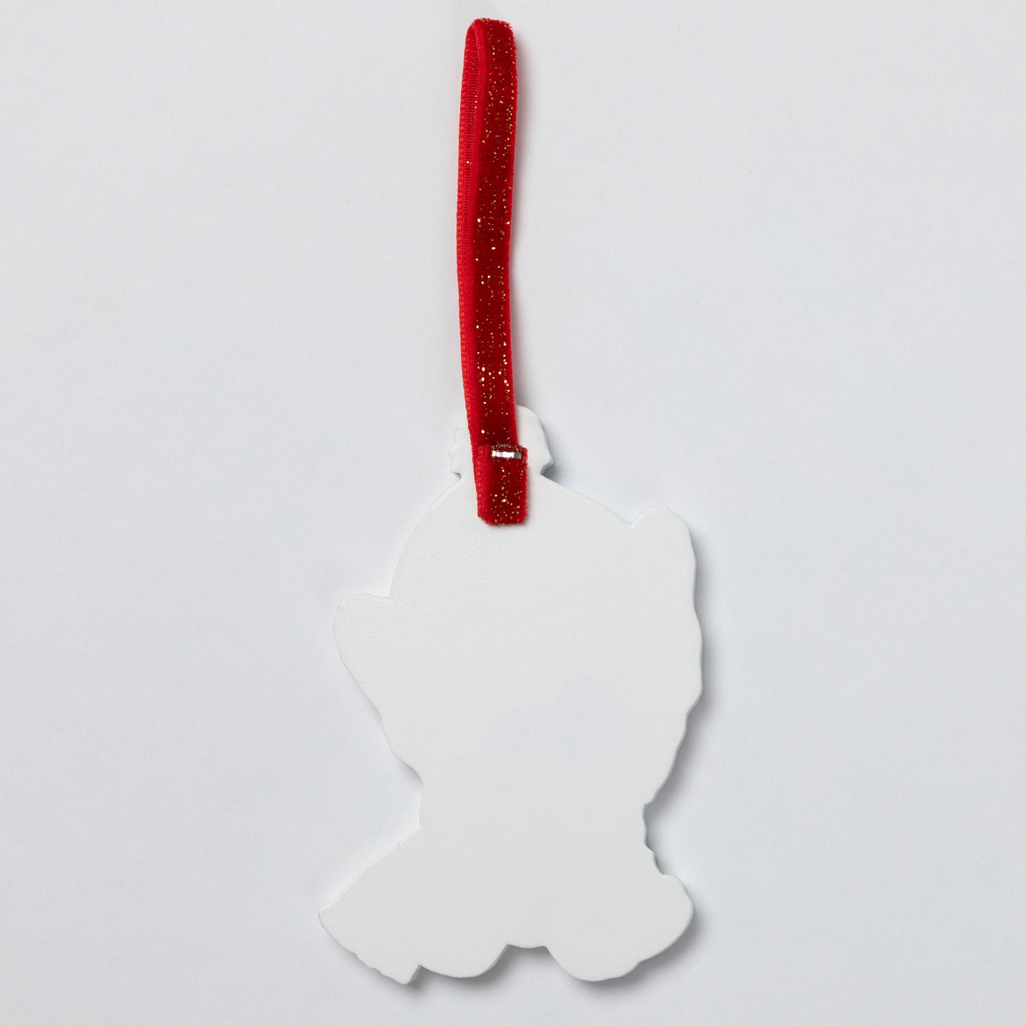 A white silhouette-shaped hanging ornament with a red glittery ribbon loop, shown against a plain light gray background.