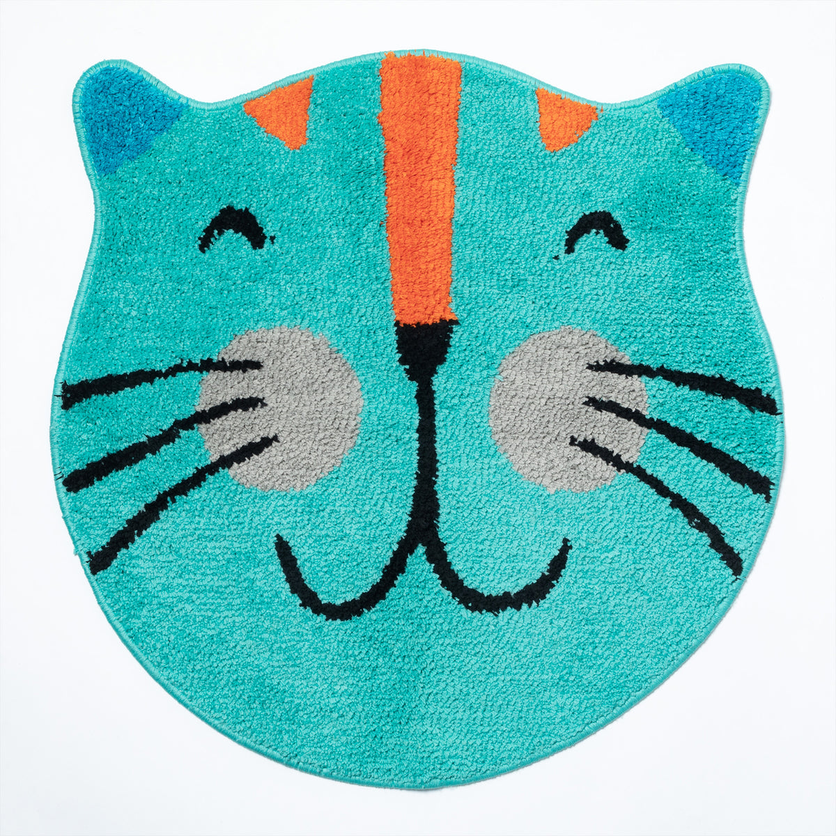 A turquoise blue cat-shaped bath mat with an orange and black striped face, gray paws, and black whiskers, shown on a plain white background.