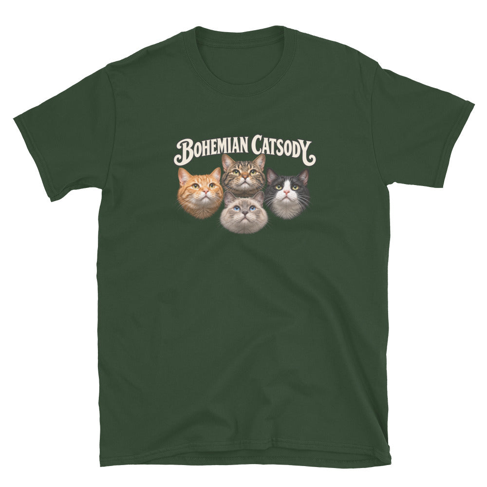 A dark green short-sleeve t-shirt with a graphic print of four different cat faces and the text 'BOHEMIAN CATSODY' above them, displayed on a solid white background.