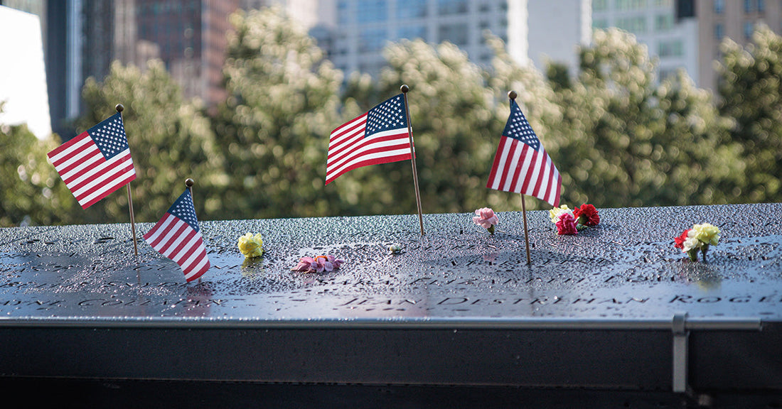 National September 11 Memorial, american flag, flowers, names, New York, USA