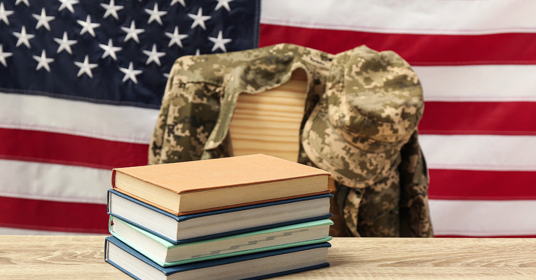 Stack of books in front of a military uniform and American flag background.