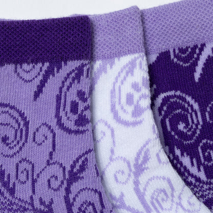 Each design included in the flourish paws purple set of three ankle-length socks. Close-up of the durable, breathable fabric on the cuff and main part of the socks. 