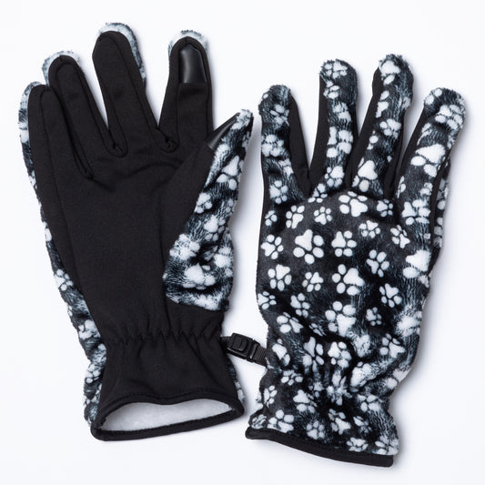 Pair of soft, warm black fleece gloves with touchscreen technology fingertips adorned with white paw print design clasped together with a small plastic clasp. 