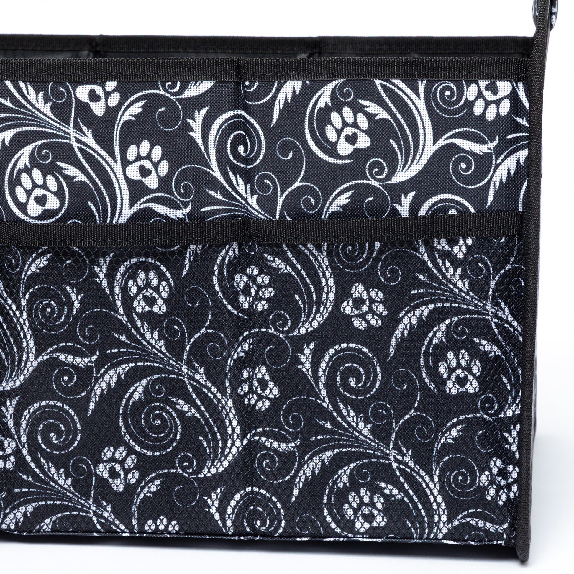 Black and white patterned bag with paw prints on a white background
