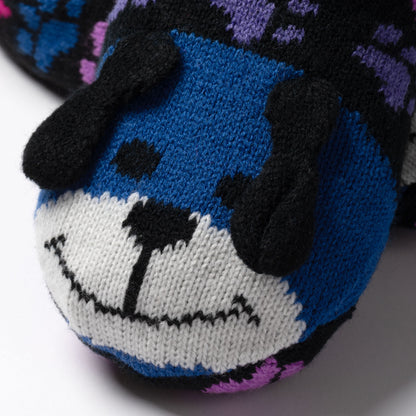 detail shot blue and rainbow paw patterned knitted slipper socks with a smiling dog face on top, on white background rainbow dog