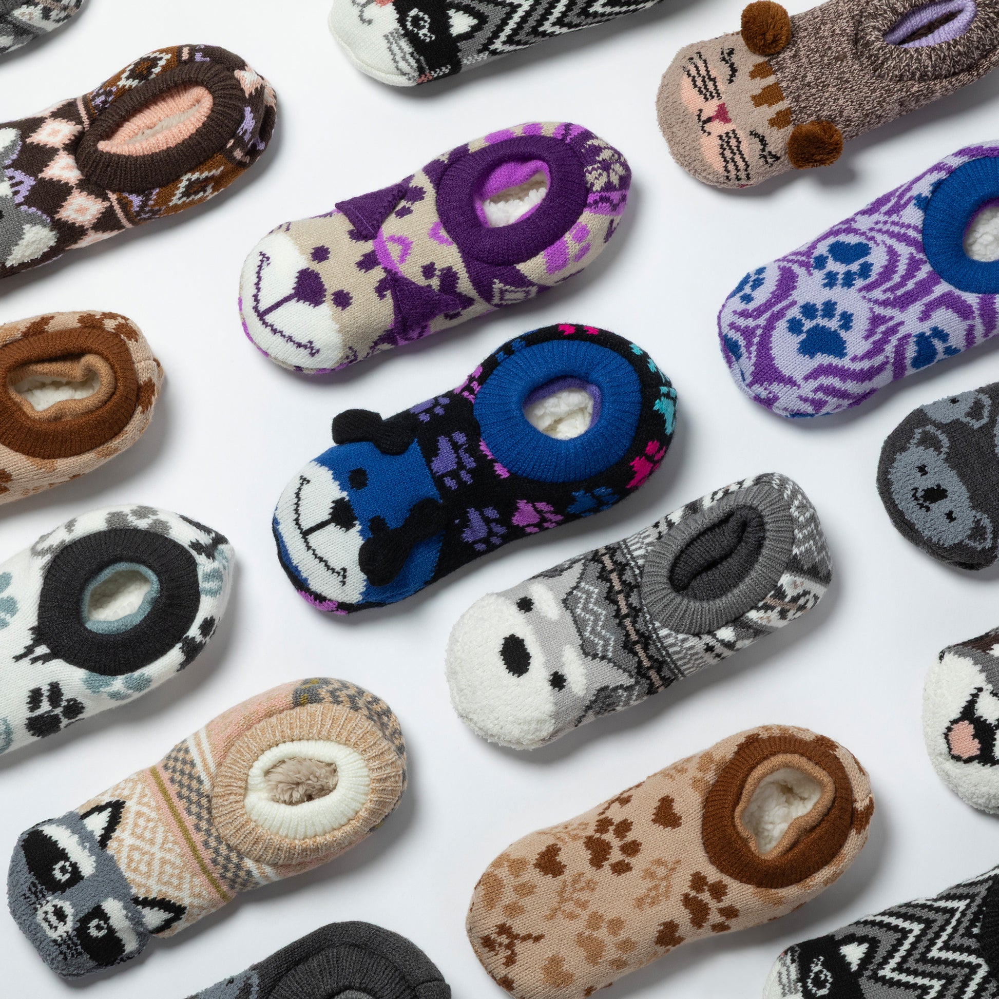 Collection of variously patterned slipper socks on a white background