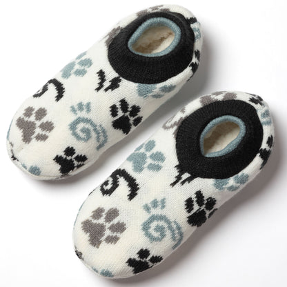 pair of white, blue, gray paw patterned knitted slipper socks, white background, showing plush interior blue gray paws swirls