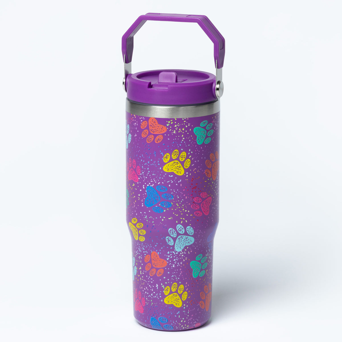 A purple insulated travel tumbler with a matching purple lid and handle, decorated with colorful paw prints and white speckles, shown on a light gray background.