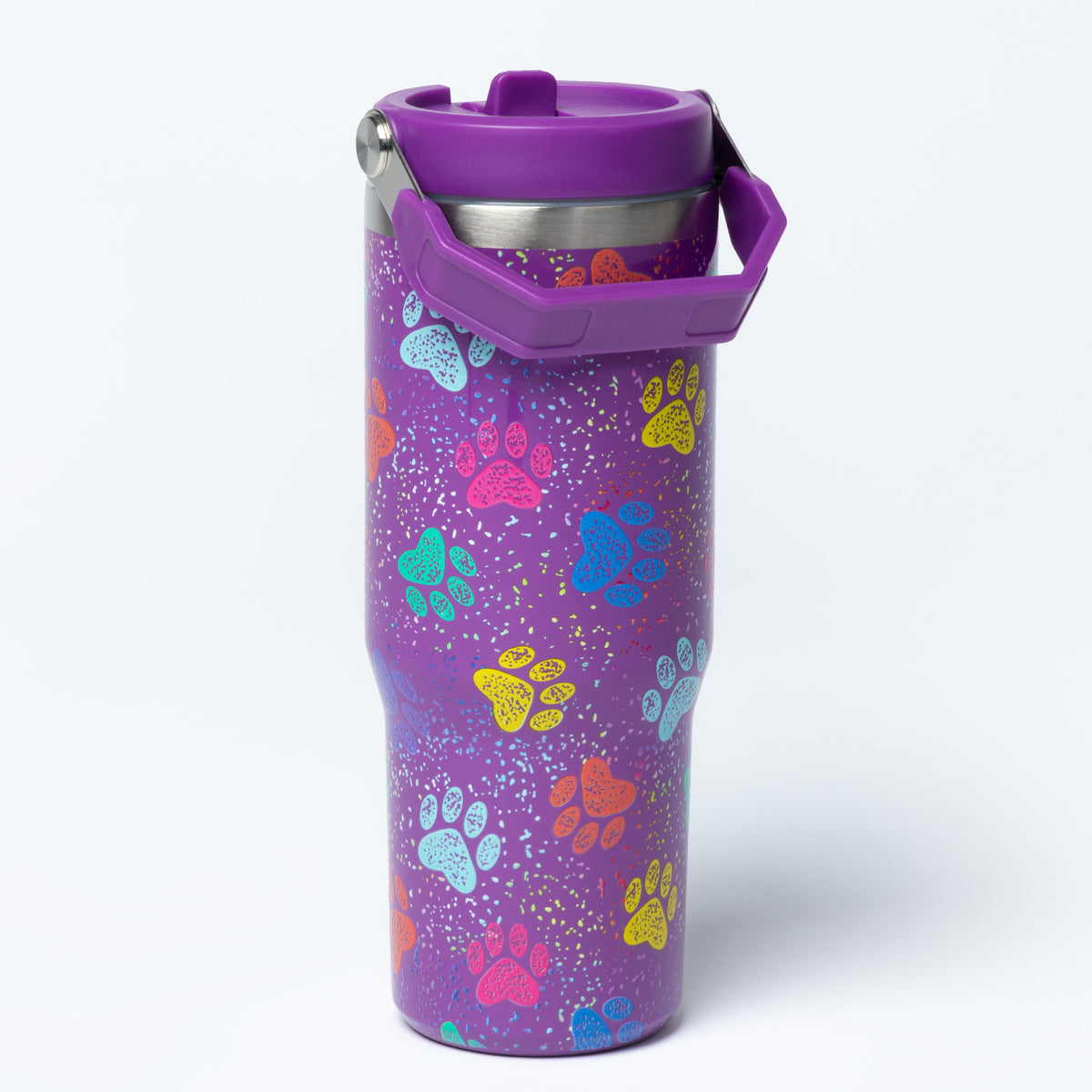 A purple insulated travel tumbler with a matching purple lid and carrying handle, decorated with colorful paw prints and small glitter-like speckles, shown on a clean white background.