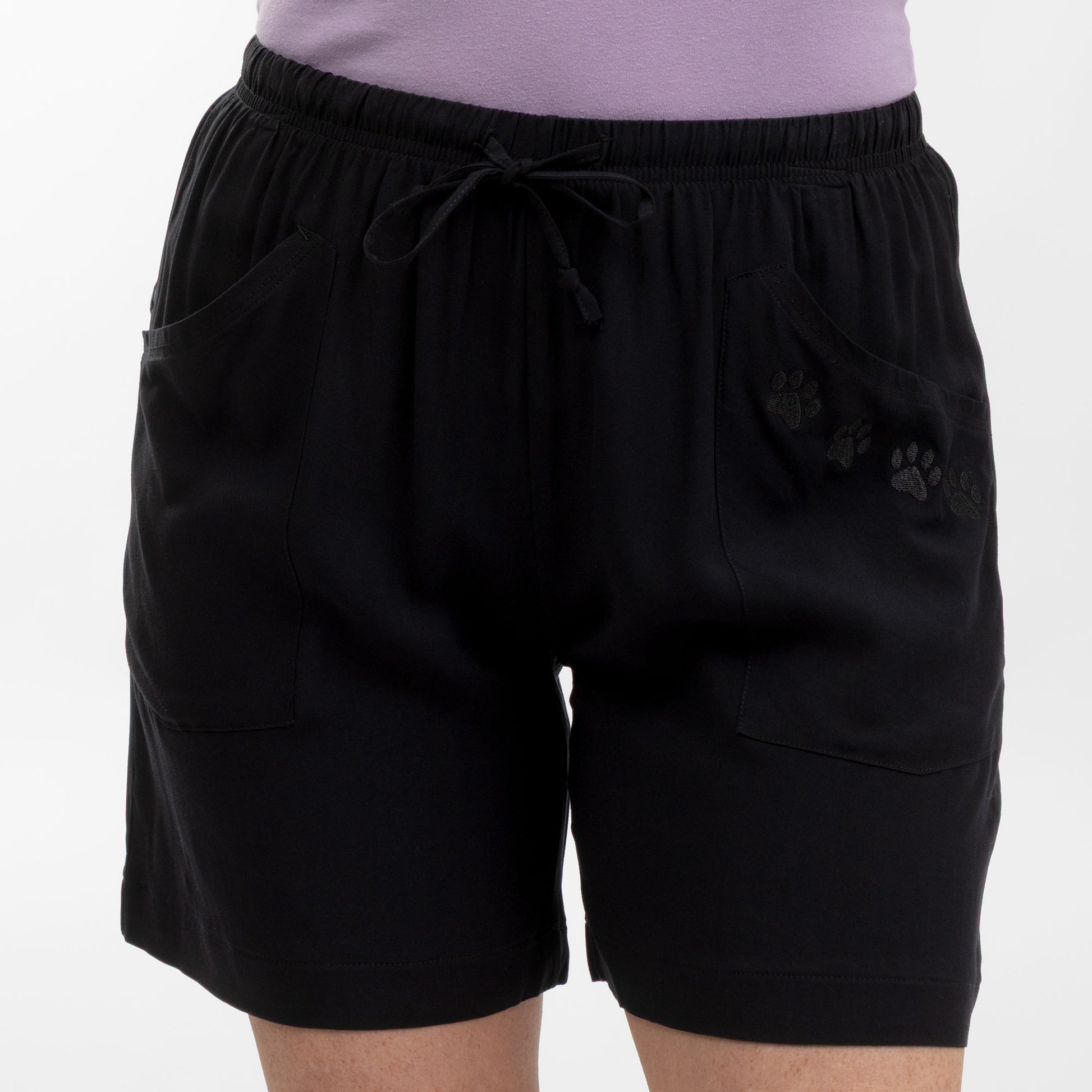 Black shorts with paw prints on a white background
