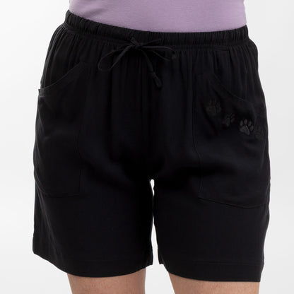 Black shorts with paw prints on a white background