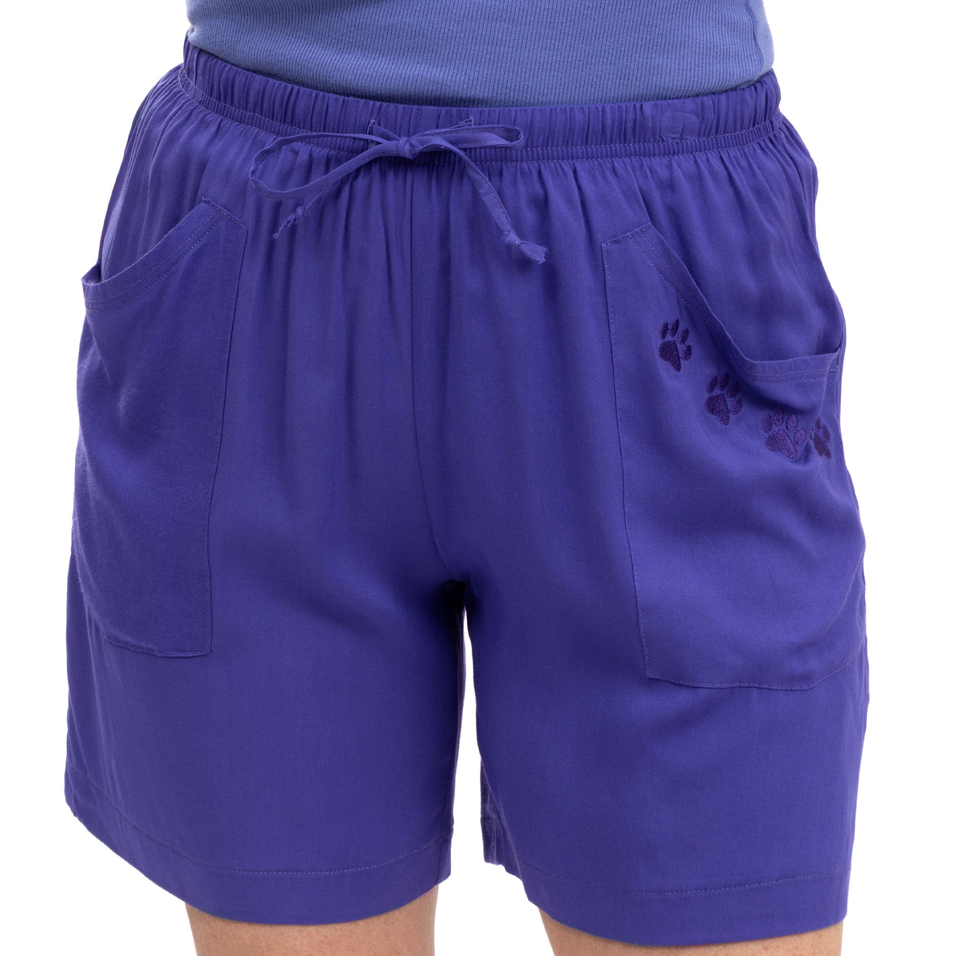 Purple shorts with paw prints on a white background