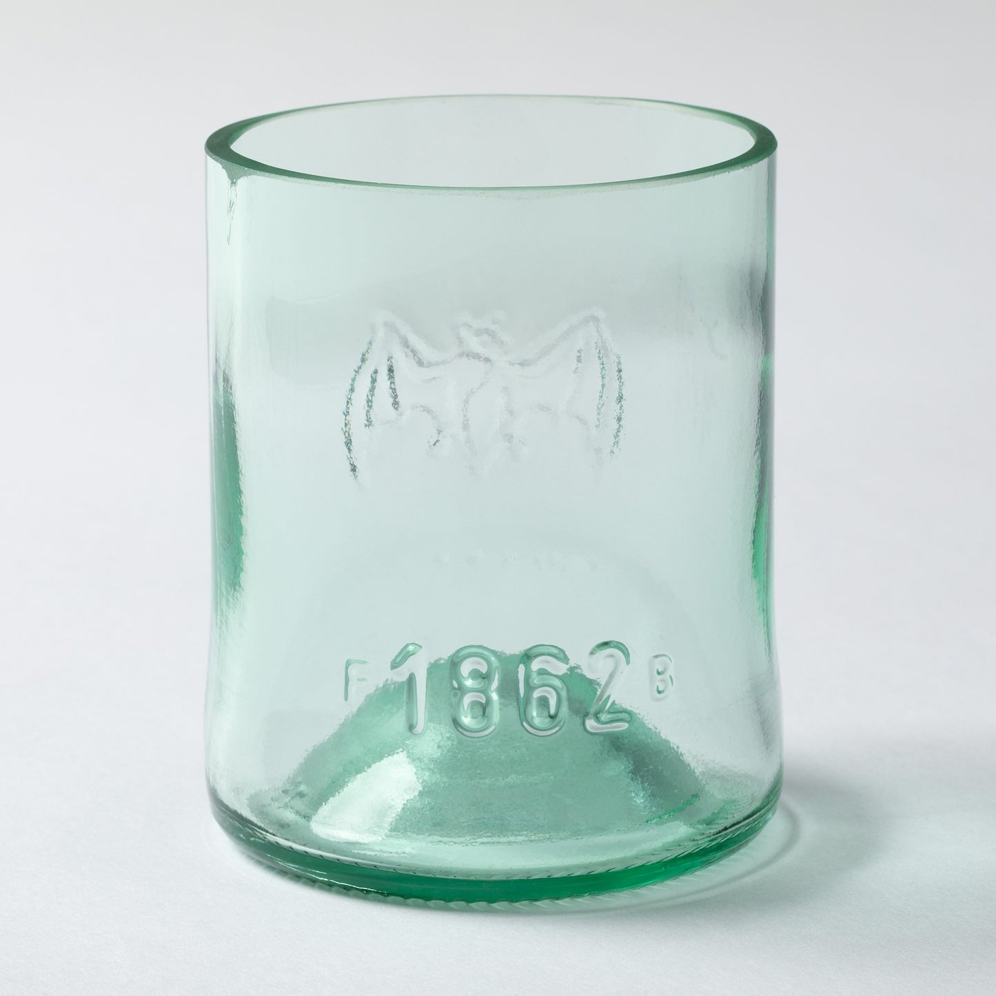 Clear recycled glass tumbler with on a white background