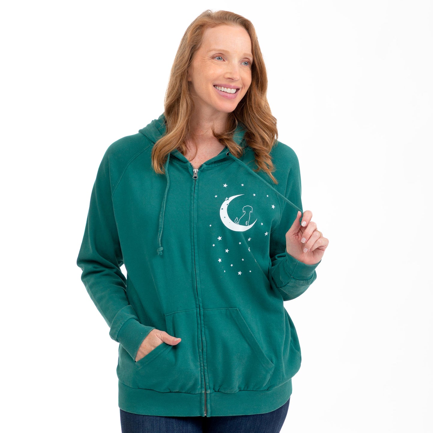 A woman wearing a teal green full-zip hoodie with a white crescent moon and stars graphic on the left chest, posed against a solid white background.