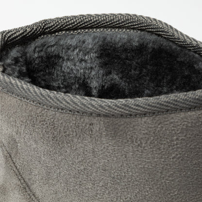Close-up of a textured gray fabric with a soft black interior lining.