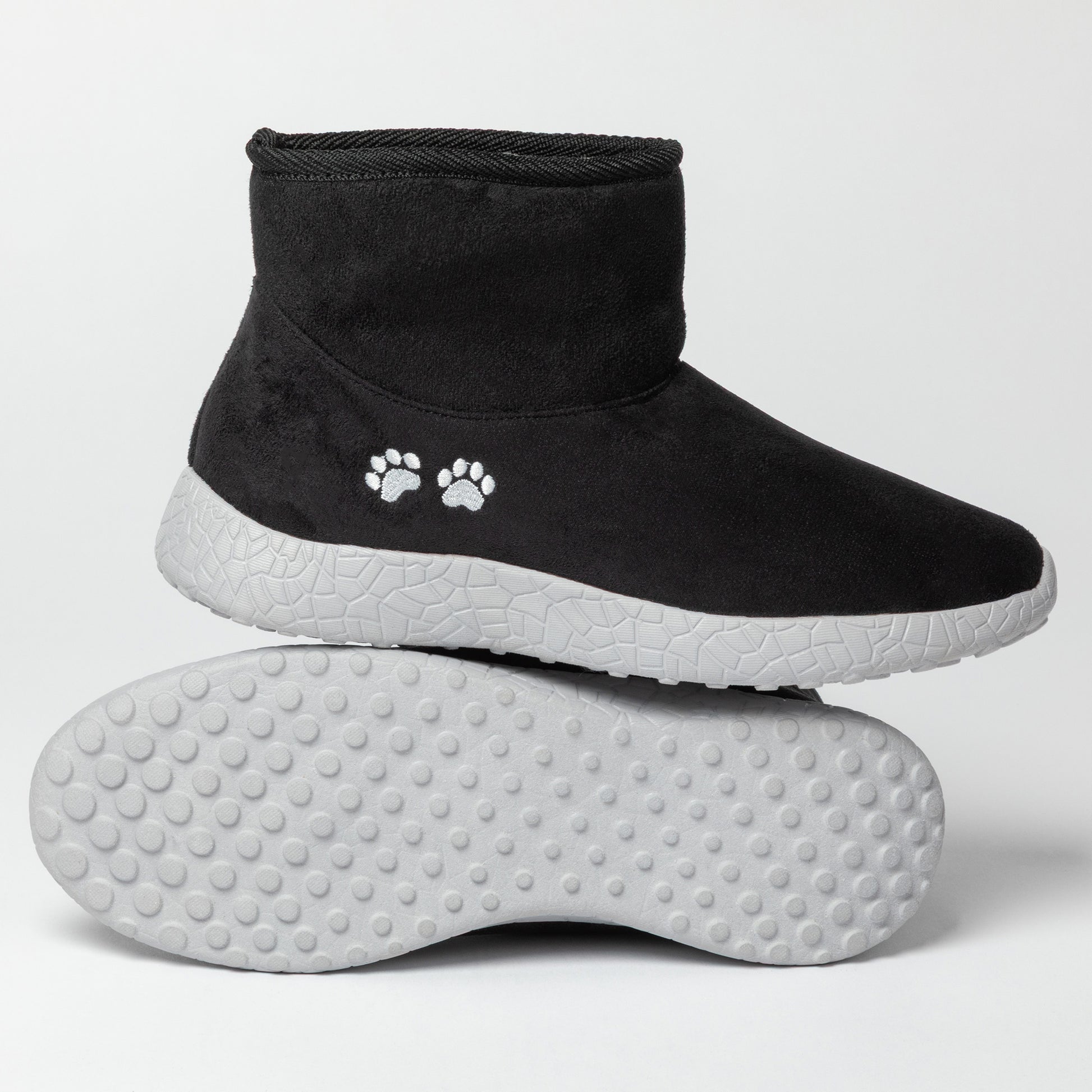 Black pet boots with white paw prints on a light gray background