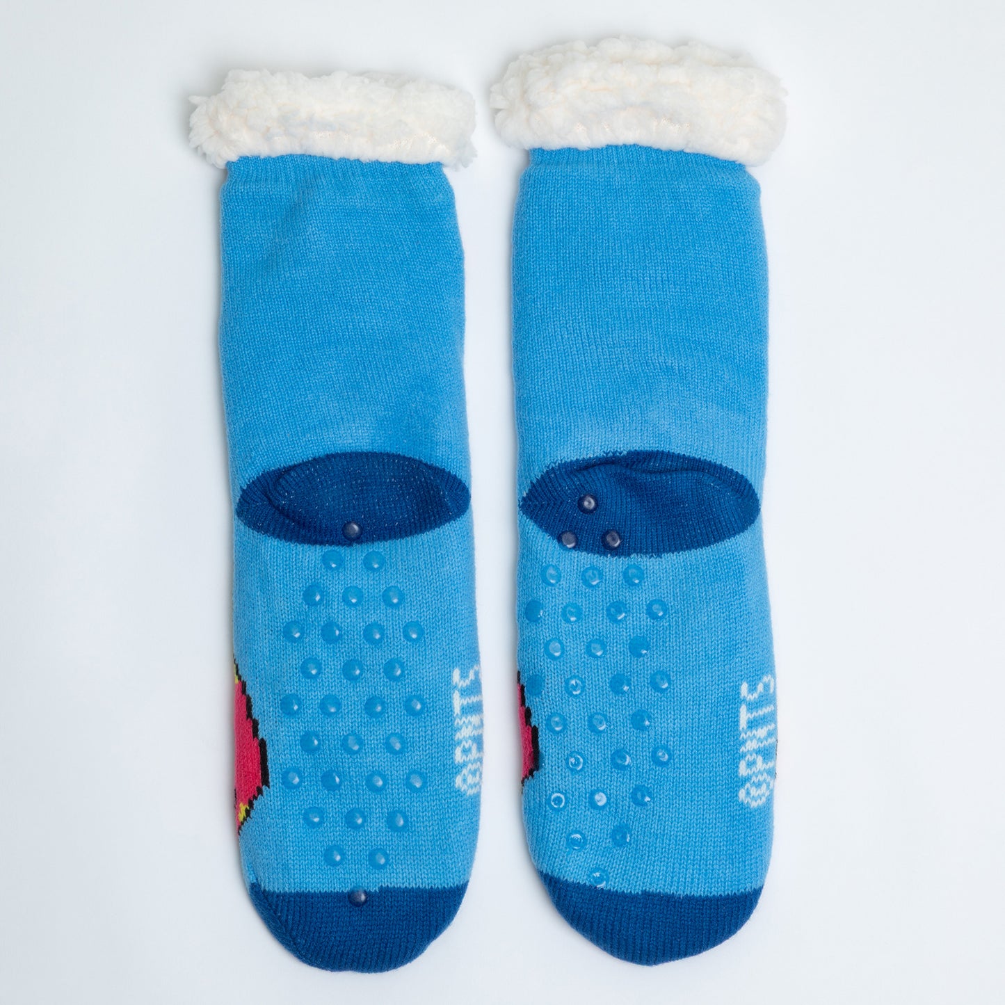 Pair of blue socks with white cuffs on a light gray background