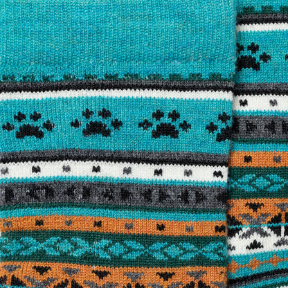Close-up of a patterned fabric with blue, orange, and black colors.