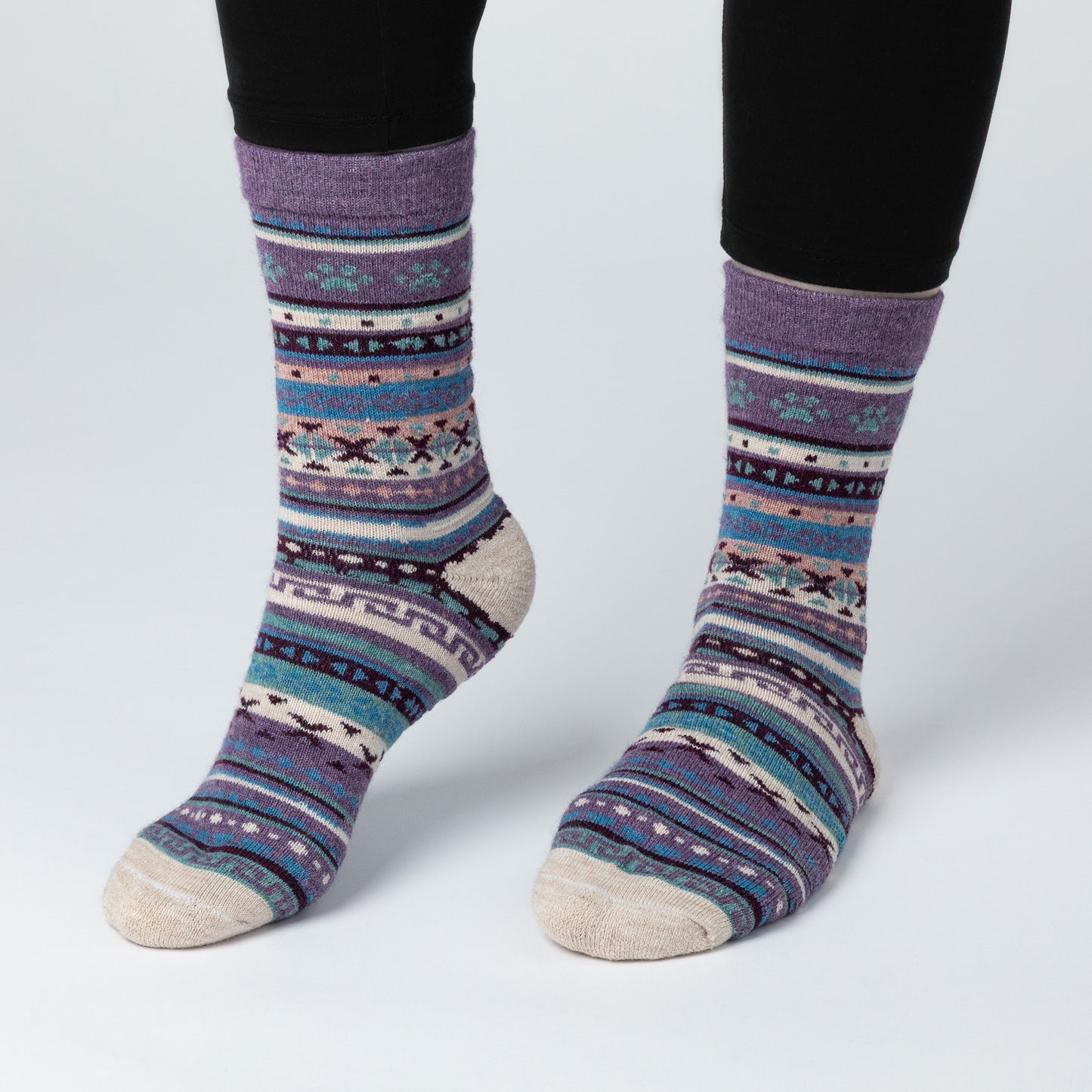 Patterned socks worn on a white background