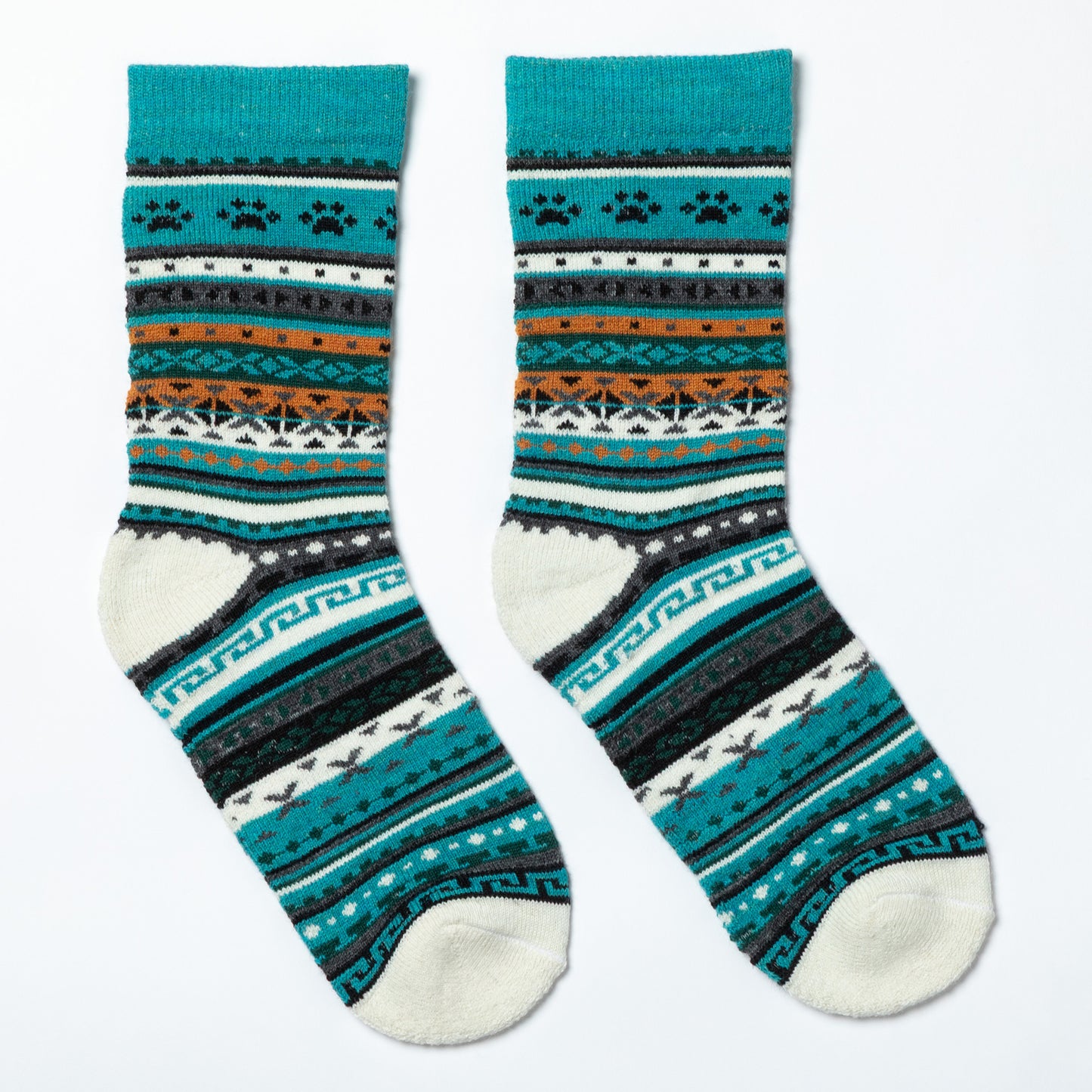 Pair of patterned socks with teal, black, and white design on a white background