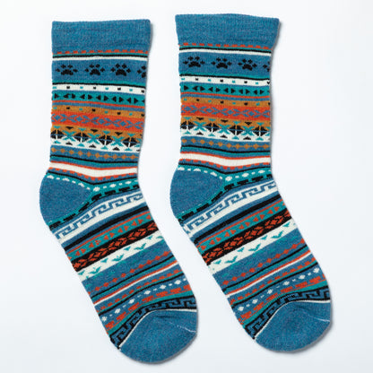 Pair of blue socks with a pattern on a white background