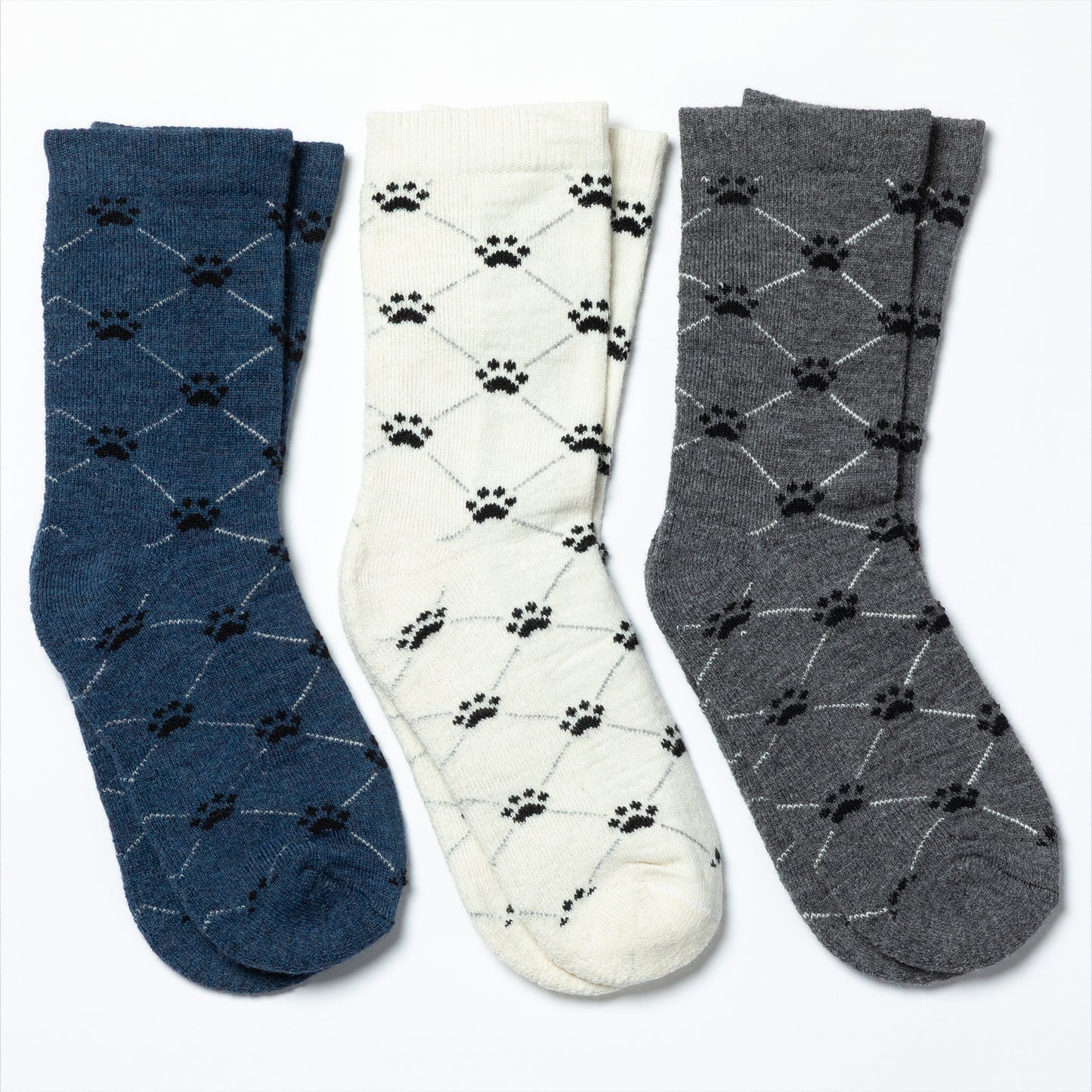 Three pairs of socks with paw pattern design on a white background