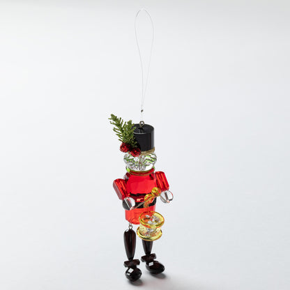 Decorative Christmas nutcracker ornament on a white background