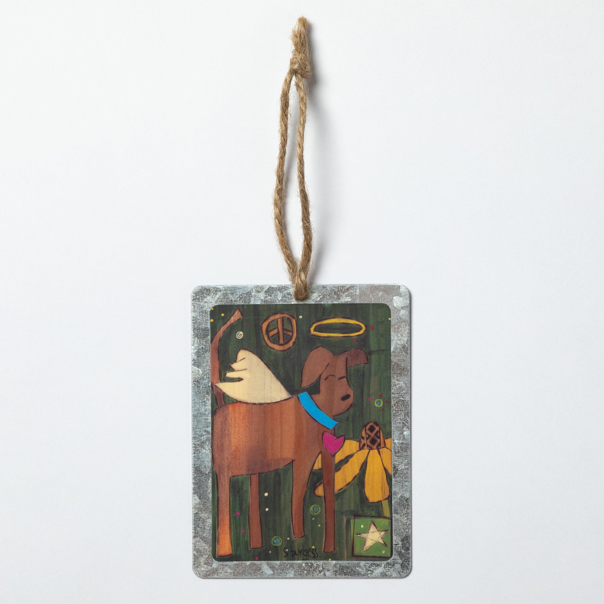 Decorative hanging ornament with a dog illustration, with a peace sign, flower and star in the back, against a white background