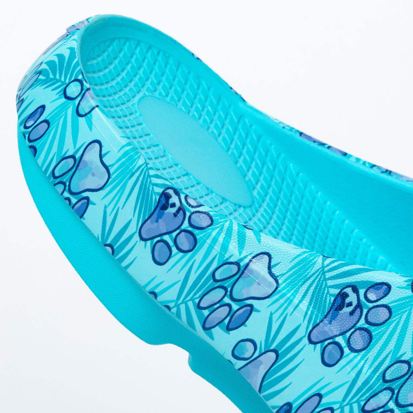 Blue sandal with paw print pattern on a white background