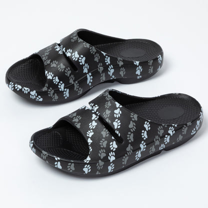 Black slides with paw print pattern on a white background