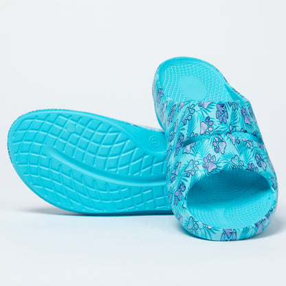 Turquoise slides with paw print pattern on a light gray background