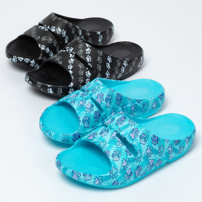 Pair of blue sandals and a pair of black sandals with paw print pattern on a white background