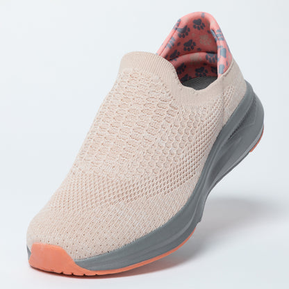 Beige slip-on shoe with gray sole on a white background