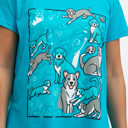 Graphic design nightgown featuring playful, illustrated dogs on a turquoise background.