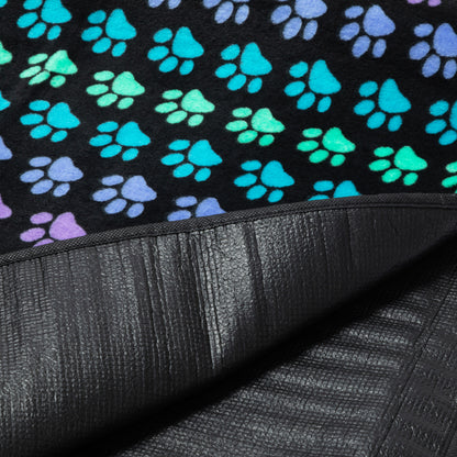Colorful paw prints fleece upper on a textured waterproof backing.