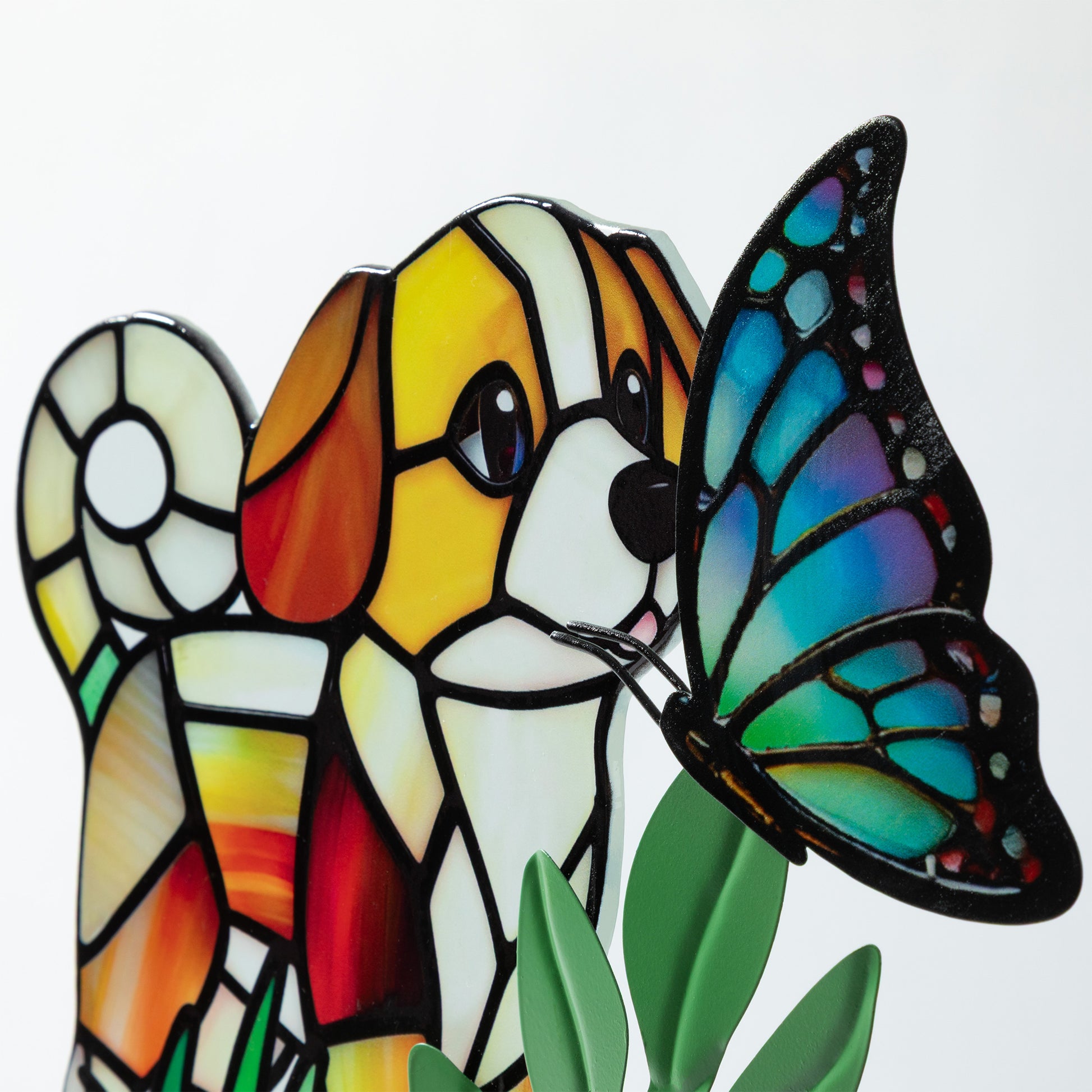 Colorful stained glass dog with a butterfly on a white background