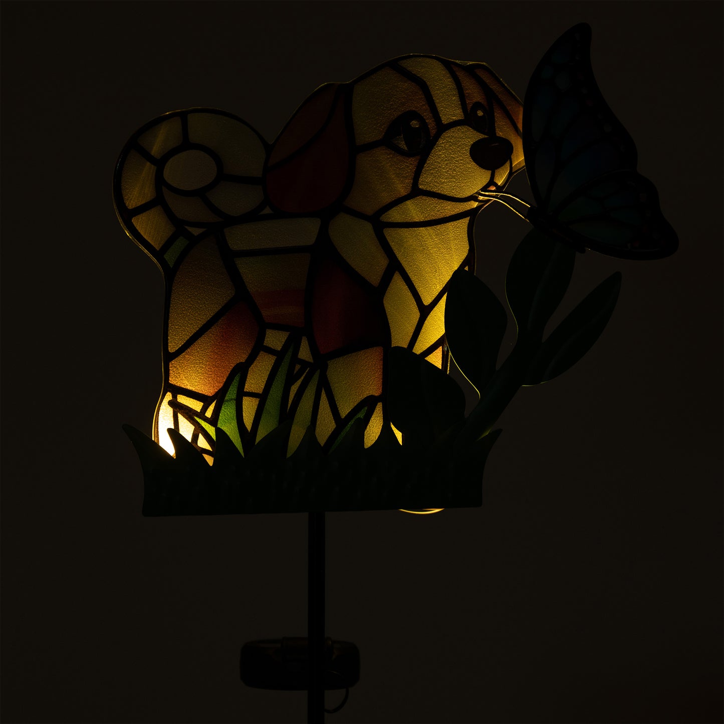 Stained glass dog lamp with a butterfly on a dark background