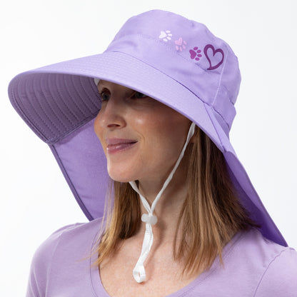 Woman wearing a purple sun hat with a neck flap on a white background.