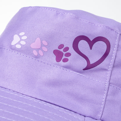 Purple fabric with paw print and heart designs on a white background