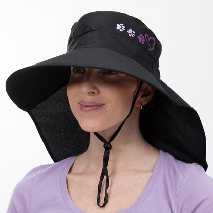 Woman wearing a black sun hat with a wide brim and neck cover on a white background