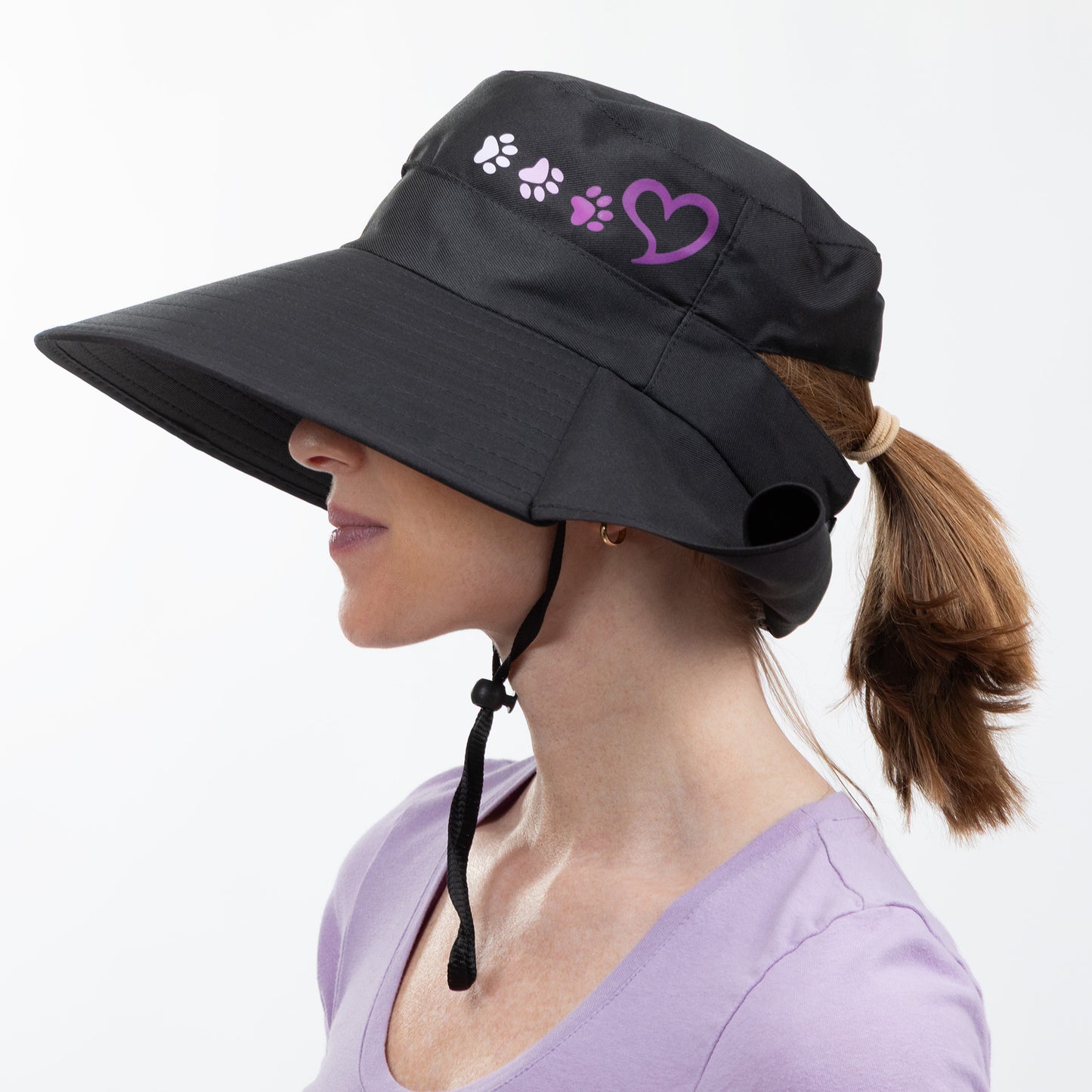 Black sun hat with paw prints and a heart on a white background