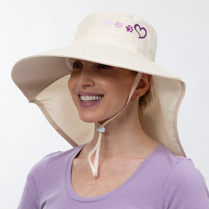 Woman wearing a beige sun hat with a neck flap on a white background