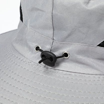 Close-up of a gray sun hat with an adjustable toggle.