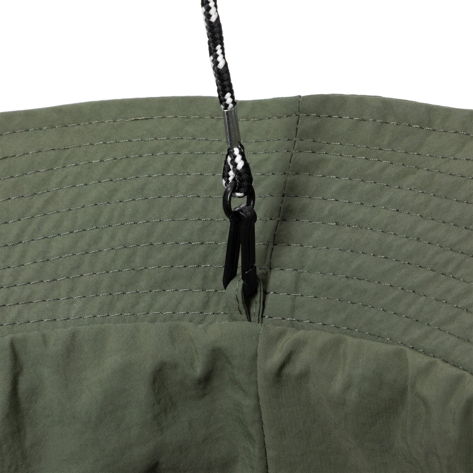 Close-up of a green bucket hat with adjustable chin strap on white background