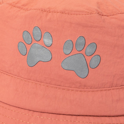 Paw print design on a coral fabric bucket hat