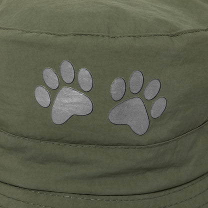 Green cap with paw print designs on a close-up view