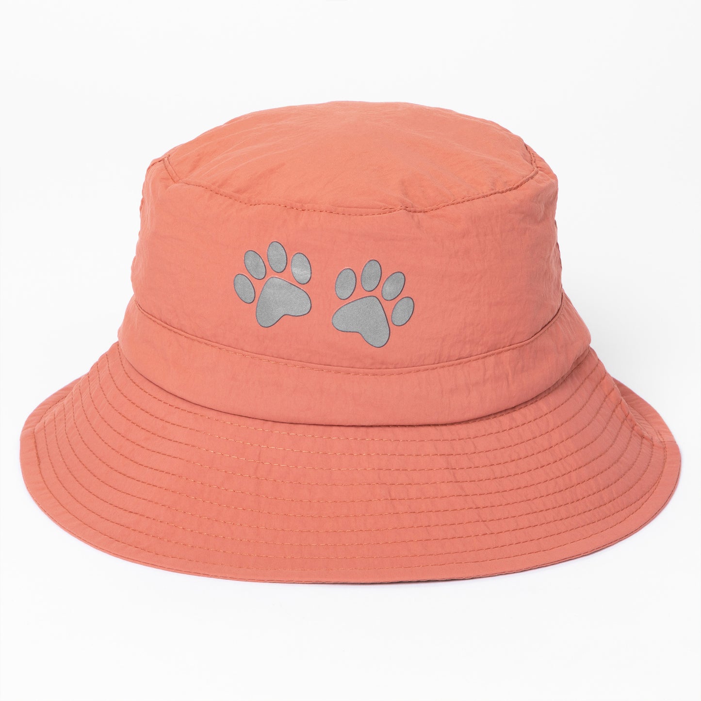 Coral bucket hat with paw prints on a white background
