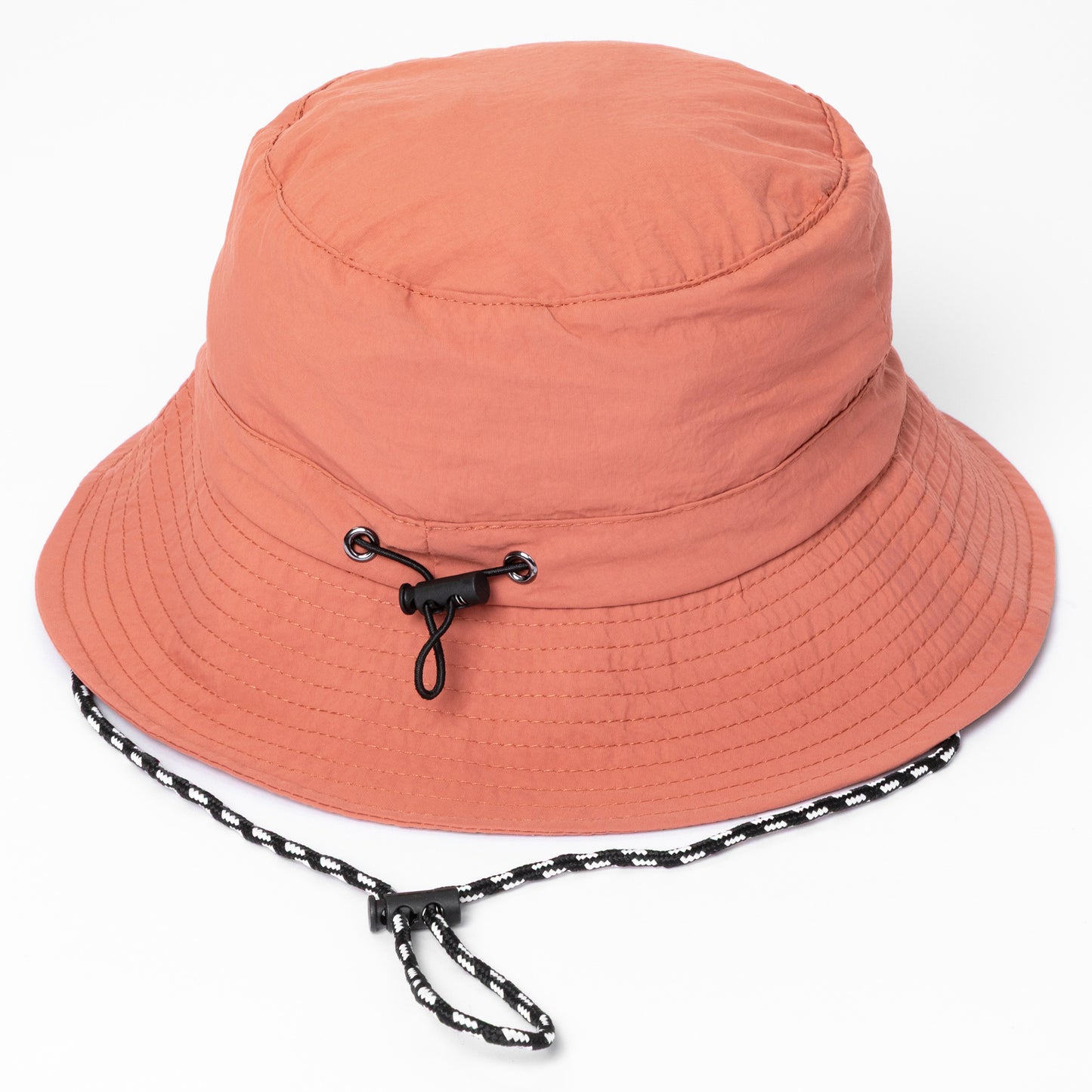 Pink bucket hat with a chin strap on a white background